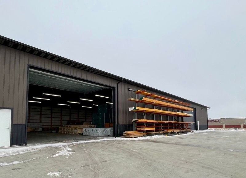 Open warehouse bay stocked with building materials