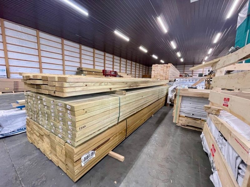 Stacked dimensional lumber inside the warehouse